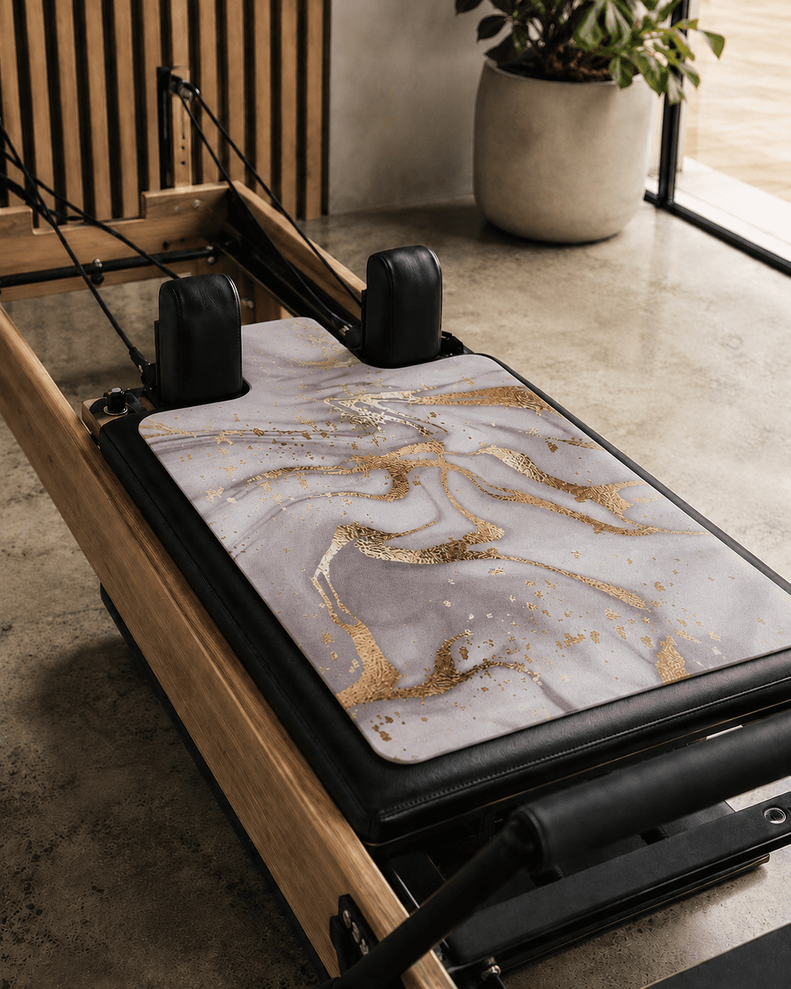 Pilates reformer with a mat